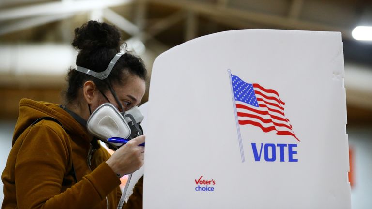 Voter marking their paper with a pen in 2020. Pic: Reuters