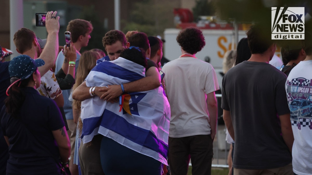 Students embrace at Flagstock