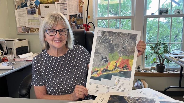 Charlestown Town Planner Jane Weidman displays a map of development around the town’s salt ponds.