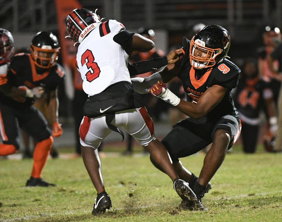 Javion Hilson of Cocoa puts the pressure on Dunnellon QB Dylan Curry during their game in the FHSAA football playoffs Friday, November 17, 2023. Craig Bailey/FLORIDA TODAY via USA TODAY NETWORK