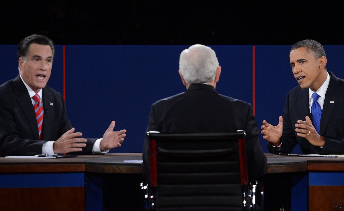 Barack Obama (R) debates with Republican presidential candidate Mitt Romney on October 22, 2012 at the start of the third presidential debate at Lynn University in Boca Raton, Florida