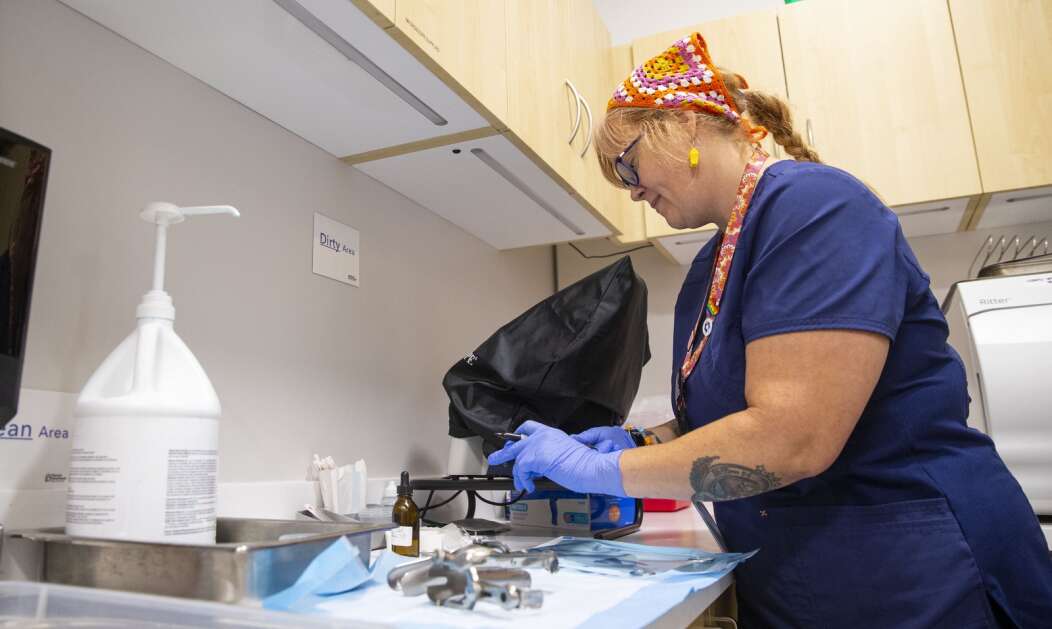 Certified clinical medical assistant Chelsea Morning works Aug. 30 on sanitizing exam tools while waiting for her next patient at Planned Parenthood in Mankato, Minn. (Savannah Blake/The Gazette)