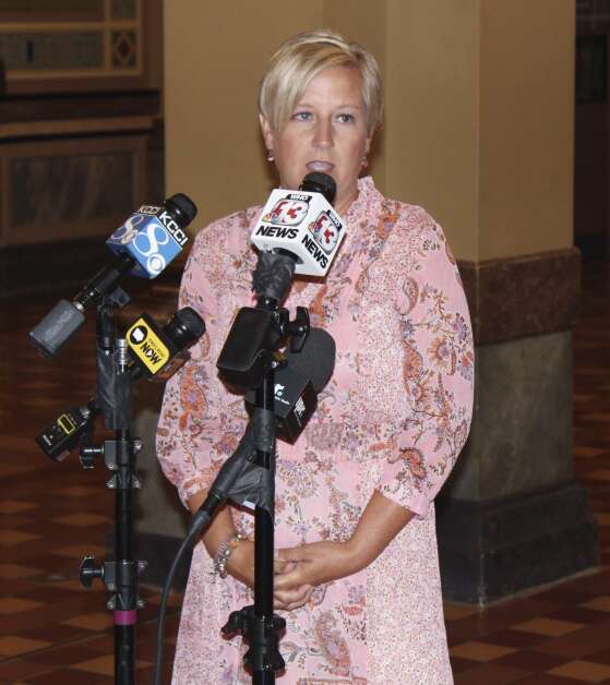 Maggie DeWitte, executive director of the anti-abortion rights advocacy group Pulse Life Advocates, speaks to reporters June 30 at the Iowa Capitol in Des Moines. (Erin Murphy/The Gazette)