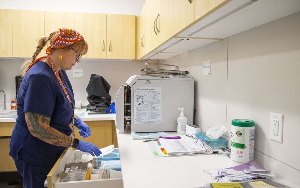 Certified clinical medical assistant Chelsea Morning works on sanitizing exam tools Aug. 30 while waiting for her next patient at the Planned Parenthood clinic in Mankato, Minn. (Savannah Blake/The Gazette)