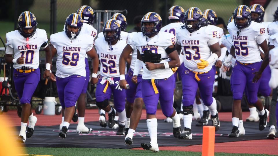 Members of the Camden High School football team enter the field prior to the game between Camden and Kingsway played at Kingsway Regional High School on Friday, September 6, 2024. Camden defeated Kingsway, 30-0.