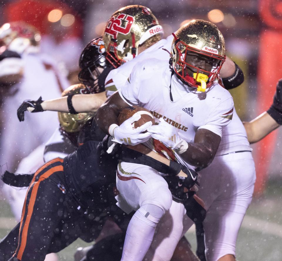 Bergen Catholic's Najee Calhoun runs for a gain in the third quarter against Massillon at Massillon Friday, September 6, 2024.