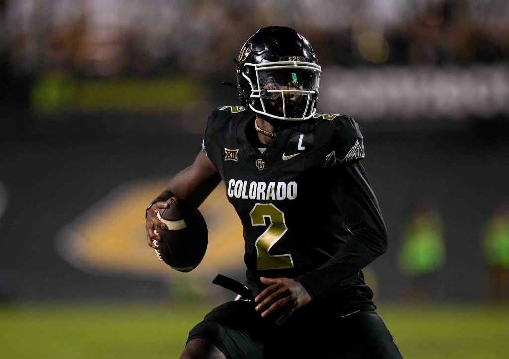 Colorado quarterback Shedeur Sanders scrambles during the second half of an NCAA college football game against North Dakota State Thursday, Aug. 29, 2024.