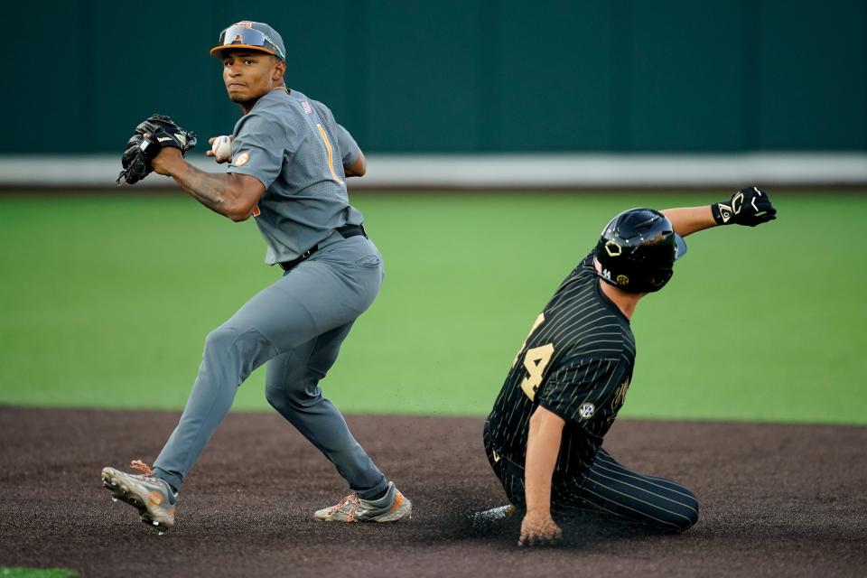 Vanderbilt designated hitter Colin Barczi (44) is forced out a second base by Tennessee second baseman Christian Moore (1) during the fourth inning at Hawkins Field in Nashville, Tenn., Friday, May 10, 2024.