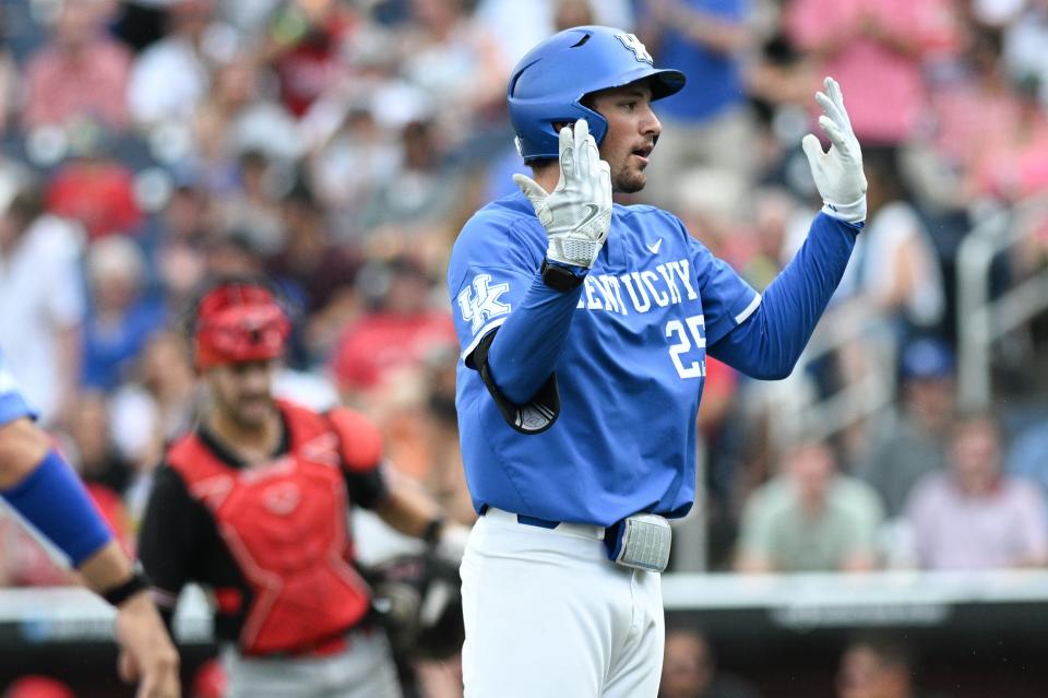 Jun 15, 2024; Omaha, NE, USA; Kentucky Wildcats first baseman Ryan Nicholson (25) celebrates hitting a home run against the NC State Wolfpack during the ninth inning at Charles Schwab Filed Omaha. Mandatory Credit: Steven Branscombe-USA TODAY Sports