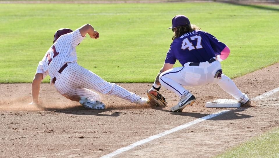 May 11 2024; Tuscaloosa, AL, USA; LSU third baseman Tommy White tags out Alabama base runner William Hamiter (11) at Sewell-Thomas Stadium Saturday. Alabama lost 6-3 as LSU evened the weekend series.