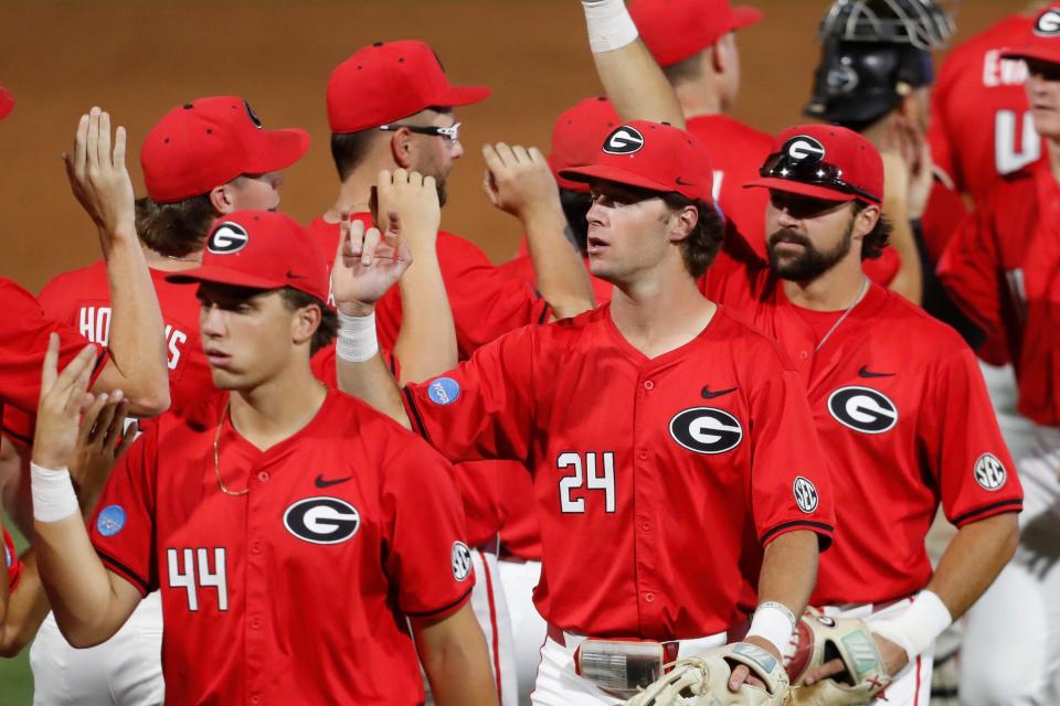 Georgia celebrates after winning a NCAA Athens Regional baseball game against UNCW in Athens, Ga., on Saturday, June 1, 2024. Georgia won 11-2.