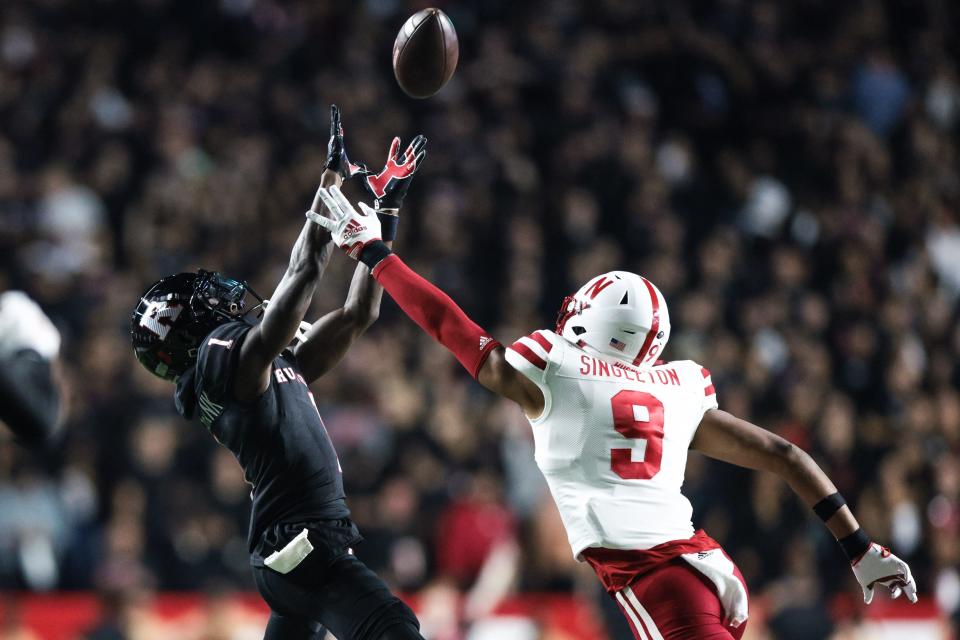 Oct 7, 2022; Piscataway, New Jersey, USA; Rutgers Scarlet Knights wide receiver Aron Cruickshank (1) carries the ball as Nebraska Cornhuskers defensive back DeShon Singleton (9) defends during the first half at SHI Stadium. Mandatory Credit: Vincent Carchietta-USA TODAY Sports