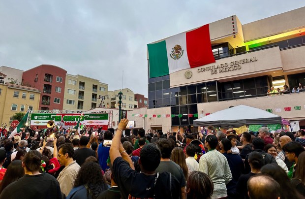 A crowd gathers in front of the Mexican Consulate in Little Italy on Sept. 15, 2023, for El Grito to kick off Mexican Independence Day celebrations in San Diego. (Alexandra Mendoza / U-T file)