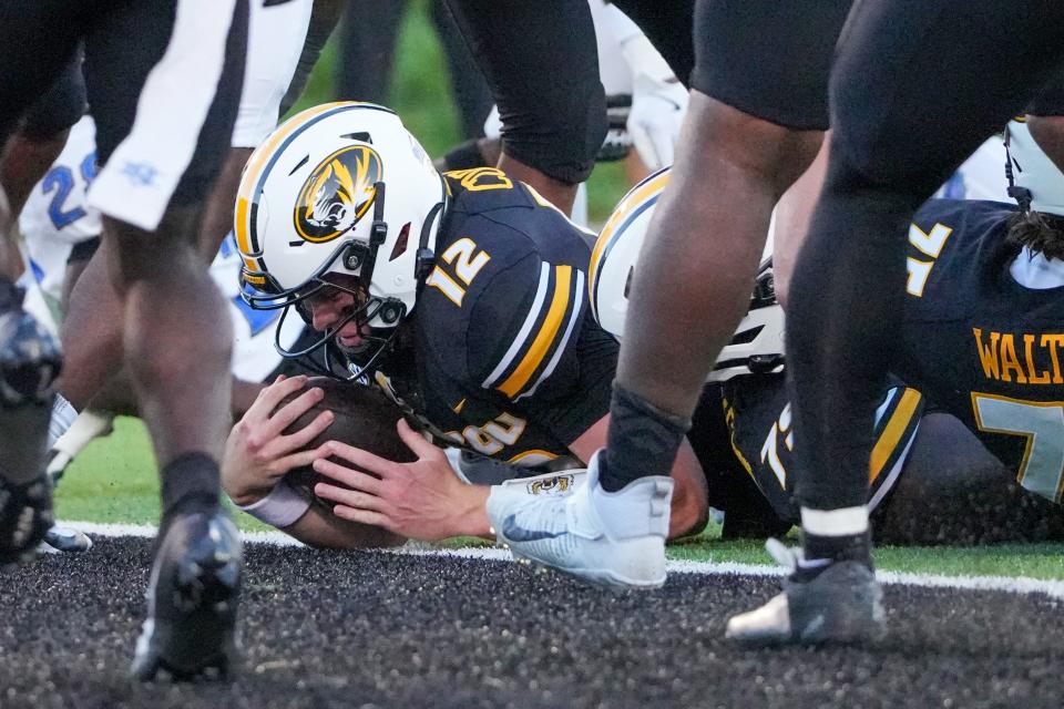 Sep 7, 2024; Columbia, Missouri, USA; Missouri Tigers quarterback Brady Cook (12) runs in for a touchdown against the Buffalo Bulls during the first half at Faurot Field at Memorial Stadium.