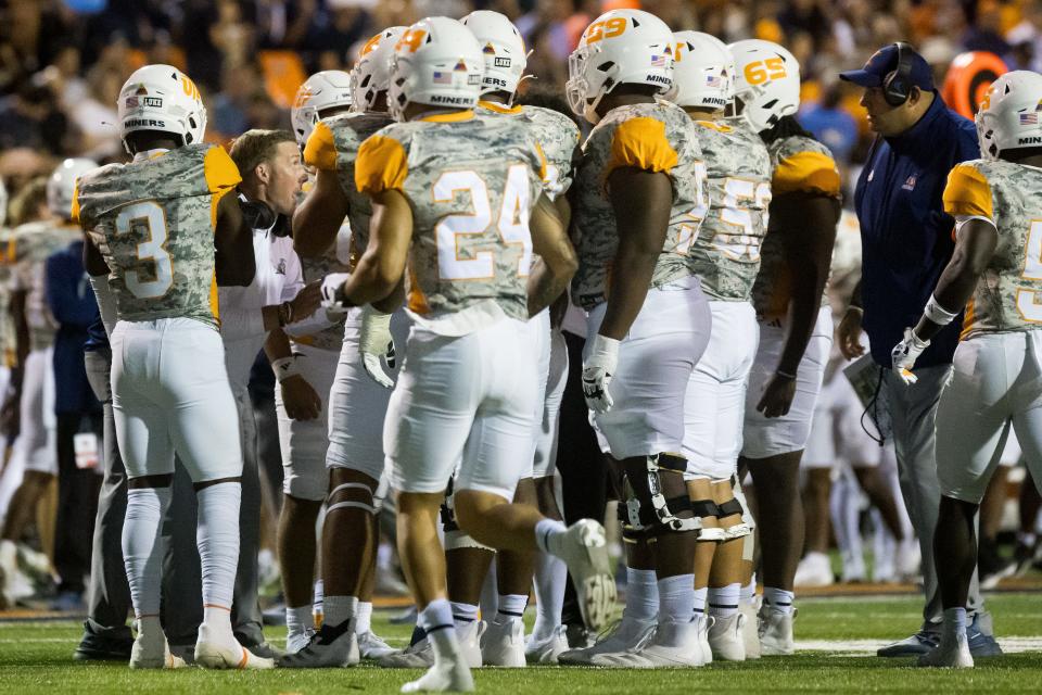 UTEP head coach Scotty Walden talks to his team during a timeout at their home opener against Southern Utah at the Sun Bowl Stadium in El Paso, Texas, on Saturday, Sept. 7, 2024.