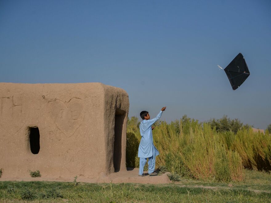 An Afghan boy flies a kite on the outskirts of Herat in September 2021. 