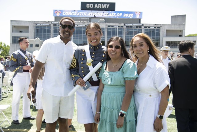 Cadet Alma Cooper poses for a photo with her family following graduation at the United States Military Academy in May 2023.