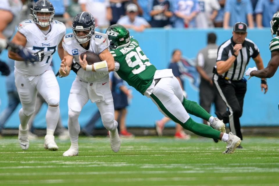 Sep 15, 2024; Nashville, Tennessee, USA; New York Jets defensive end Will McDonald IV (99) tackles Tennessee Titans quarterback Will Levis (8) for a loss during the first half at Nissan Stadium. Mandatory Credit: Steve Roberts-Imagn Images