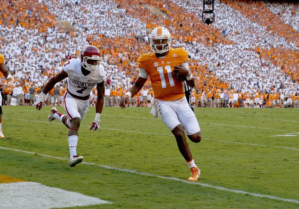 Joshua Dobbs #11 of the Tennessee Volunteers runs for a touchdown against the Oklahoma Sooners during the game at Neyland Stadium on September 12, 2015 in Knoxville, Tennessee. (Photo by Andy Lyons/Getty Images)