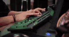 Hands typing on a mechanical keyboard, nails painted white