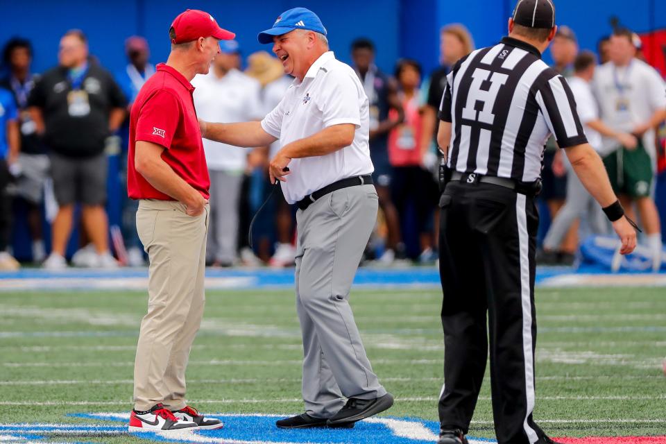 Sep 16, 2023; Tulsa, Oklahoma, USA; OU head coach Brent Venables and Tulsa head coach Kevin Wilson talk before a game at Skelly Field at H.A. Chapman Stadium. Mandatory Credit: Nathan J. Fish-USA TODAY Sports