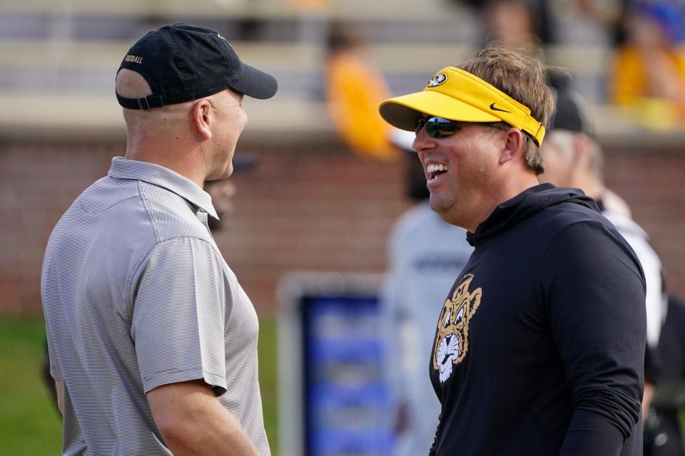 Oct 22, 2022; Columbia, Missouri, USA; Vanderbilt Commodores head coach Clark Lea (left) talks with Missouri Tigers head coach Eli Drinkwitz prior to the game at Faurot Field at Memorial Stadium. Mandatory Credit: Denny Medley-USA TODAY Sports