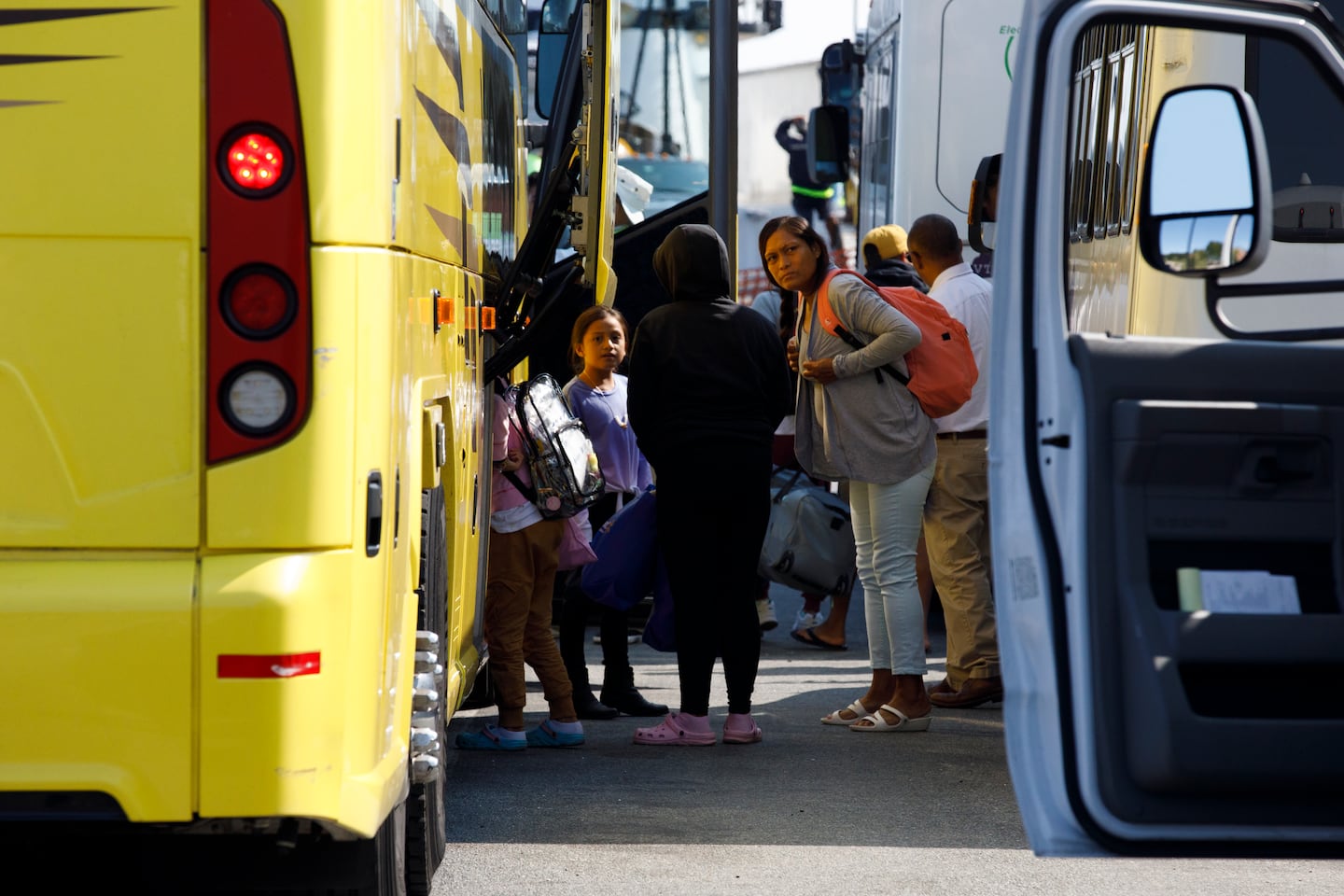 Estrella and her daughter gathered at the Vineyard Haven ferry terminal in Martha’s Vineyard on Sept. 16, 2022. The group was transported to Joint Base Cape Cod in Buzzards Bay.