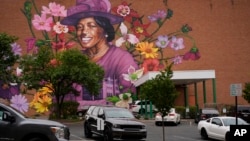 A mural depicting Hattie Moseley, a Springfield Civil Rights activist, is painted on the WesBanco building on East Main Street in Springfield, Ohio, Sept. 17, 2024, in Springfield, Ohio.