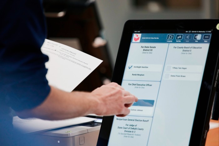 An election official carries out an elections security health check