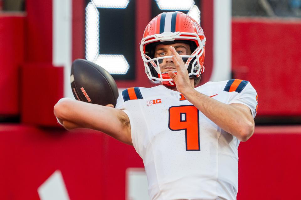 Sep 20, 2024; Lincoln, Nebraska, USA; Illinois Fighting Illini quarterback Luke Altmyer (9) warms up before a game against the Nebraska Cornhuskers at Memorial Stadium. Mandatory Credit: Dylan Widger-Imagn Images