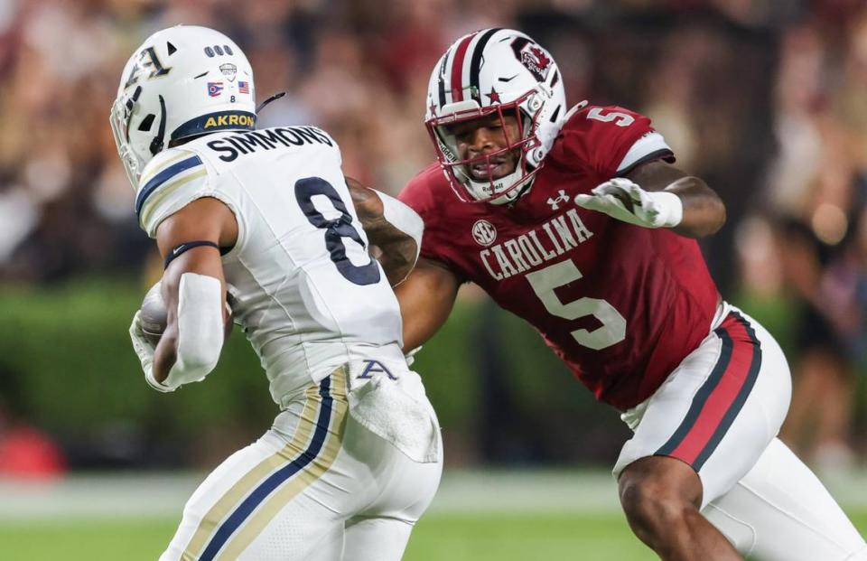 South Carolina edge Kyle Kennard (5) moves in to tackle Akron running back Jordon Simmons (8) during the first half of Gamecocks’ game against Akron in Columbia on Saturday, September 21, 2024.