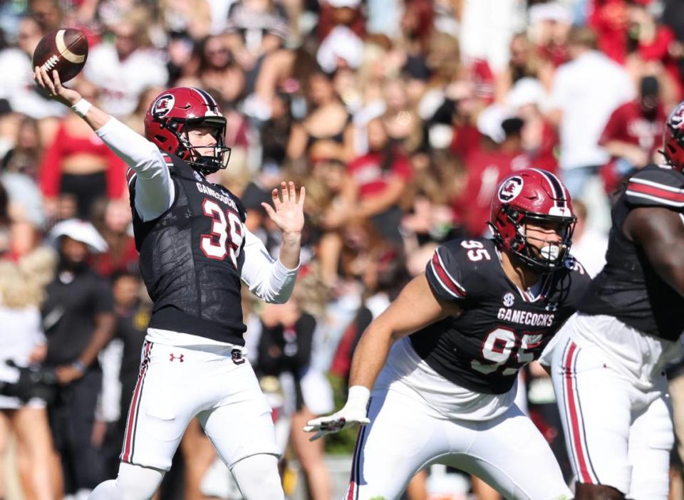 South Carolina punter Kai Kroeger (39) attempts a pass during a trick play during the first half of the Gamecocks’ game at Williams-Brice Stadium in Columbia on Saturday, November 4, 2023.