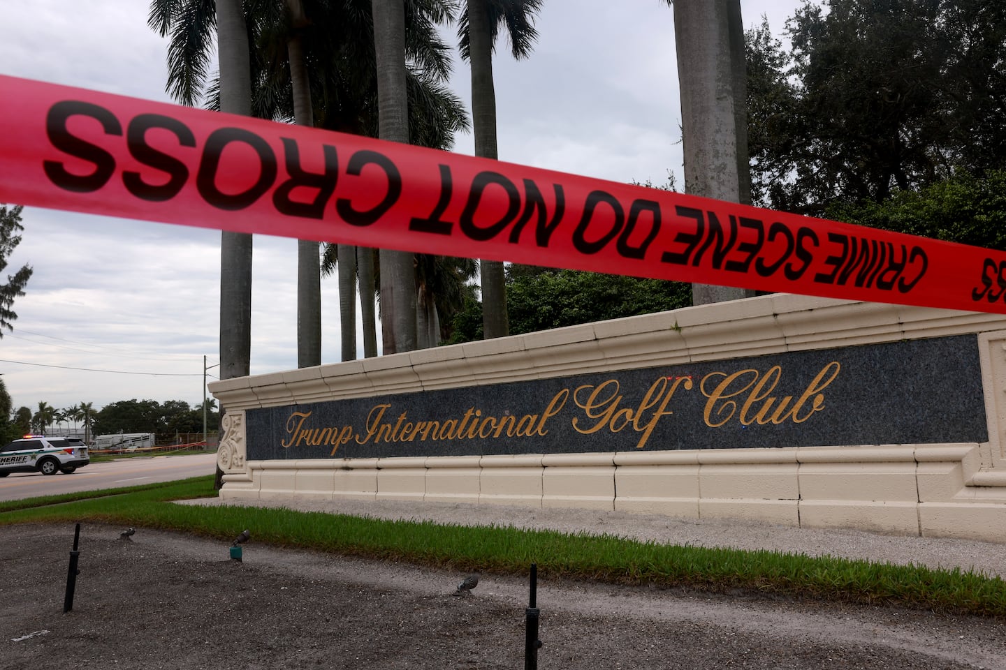 Crime scene tape marked off the area as law enforcement personnel continued to investigate the area where the Secret Service discovered a would-be assassin of former president Donald Trump at the Trump International Golf Club on Sept. 17 in West Palm Beach, Fla.