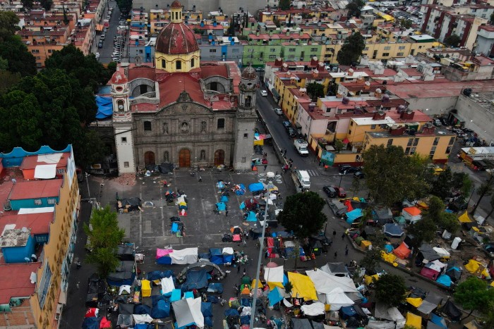 An aerial view of a migrant tent encampment in Mexico City