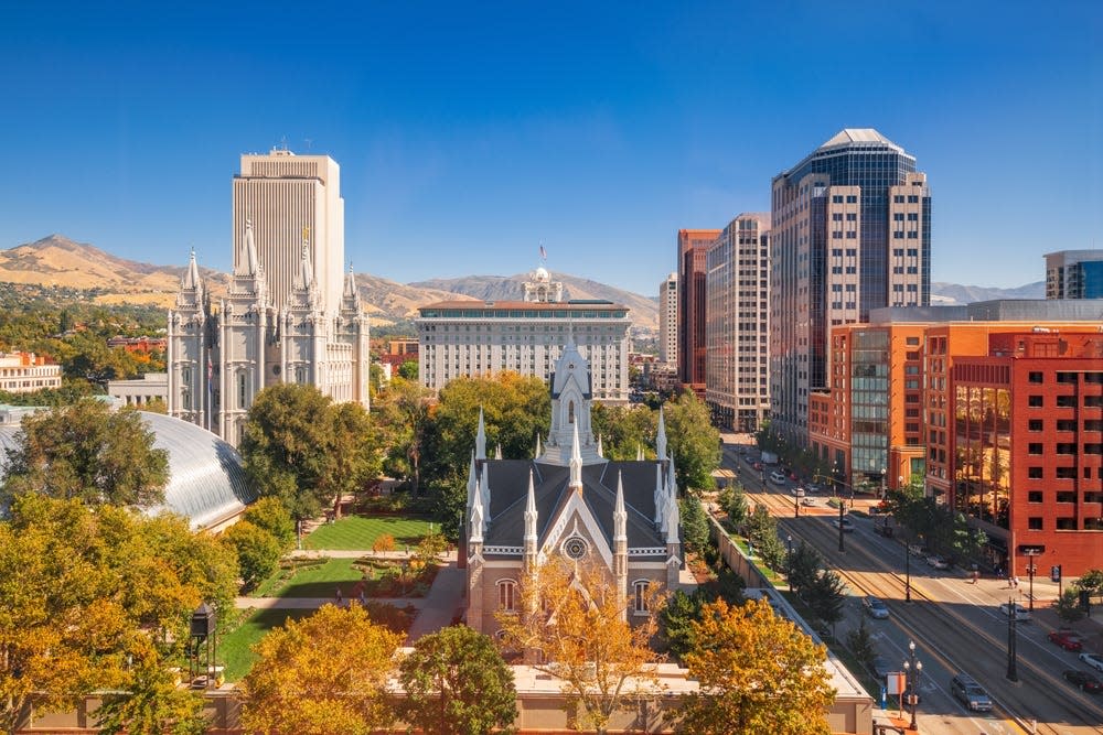 Salt Lake City, Utah, USA downtown cityscape over Temple Square with autumn foliage.