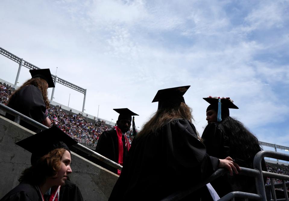 May 7, 2023; Columbus, Ohio, United States; Graduates walk up and down the stairs to visit the concession stands or bathrooms at Ohio Stadium during the Ohio State University's spring commencement on Sunday. Mandatory Credit: Barbara Perenic/The Columbus Dispatch