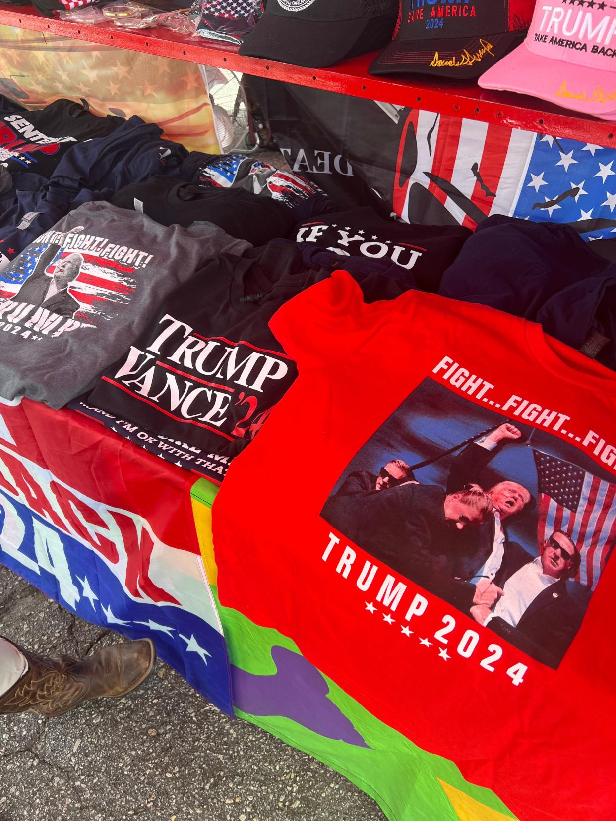 Christina Osterbind has been selling Trump merchandise at fairs and parades across states since his first presidency. Many of her products this year have sold out or nearly sold out, she said, at the North Carolina Mountain State Fair in September.