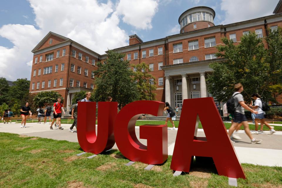 Students walk past the Zell B. Miller Learning Center during the first day of the fall semester at the University of Georgia in Athens, Ga., on Wednesday, Aug. 14, 2024. 