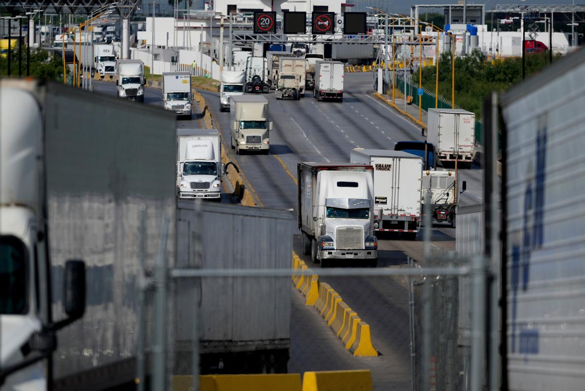 Trucks cross into the Port of Laredo in Laredo, Texas, on Friday, Aug. 9, 2024.