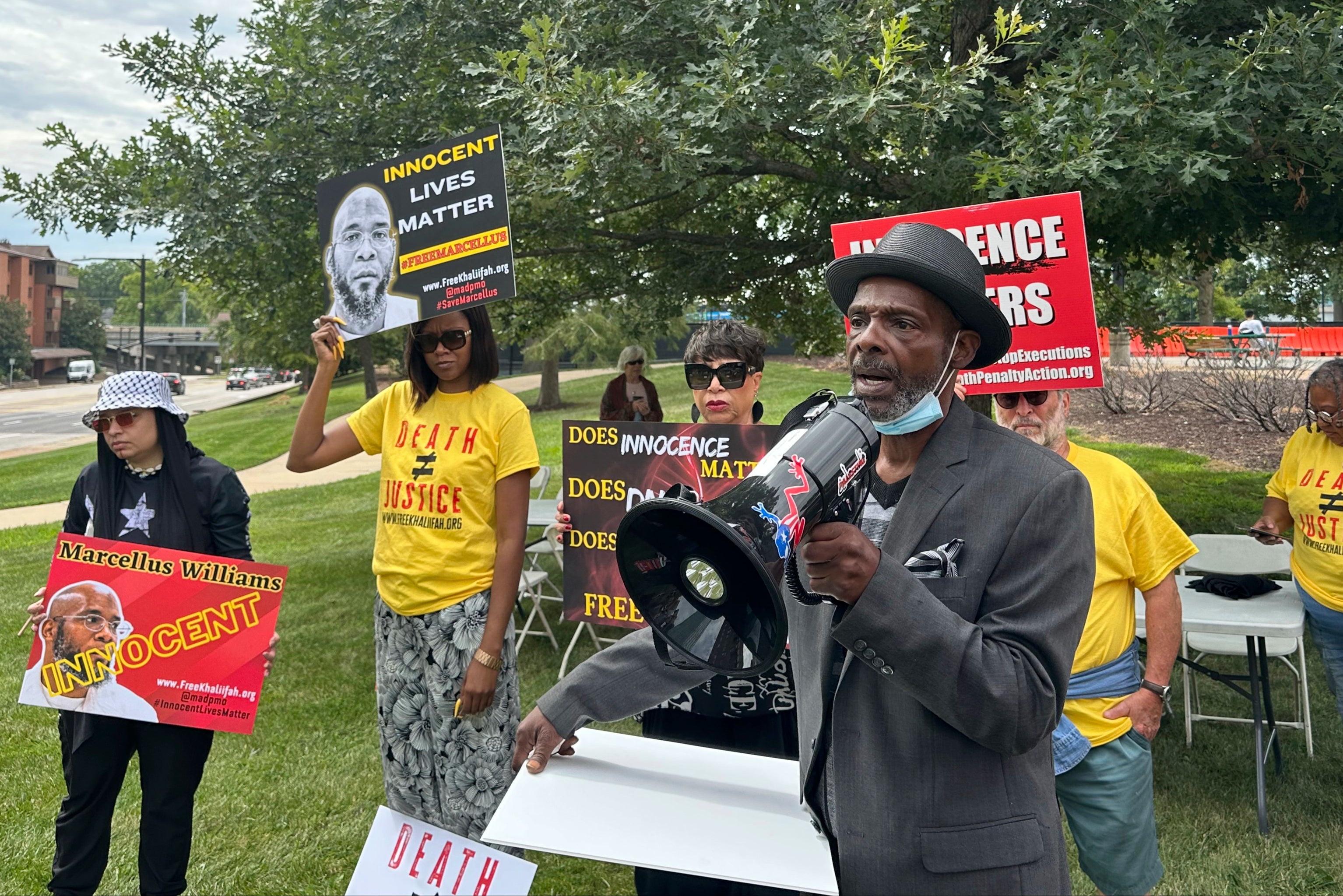 Joseph Amrine, who was exonerated two decades ago after spending years on death row, speaks at a rally to support Williams