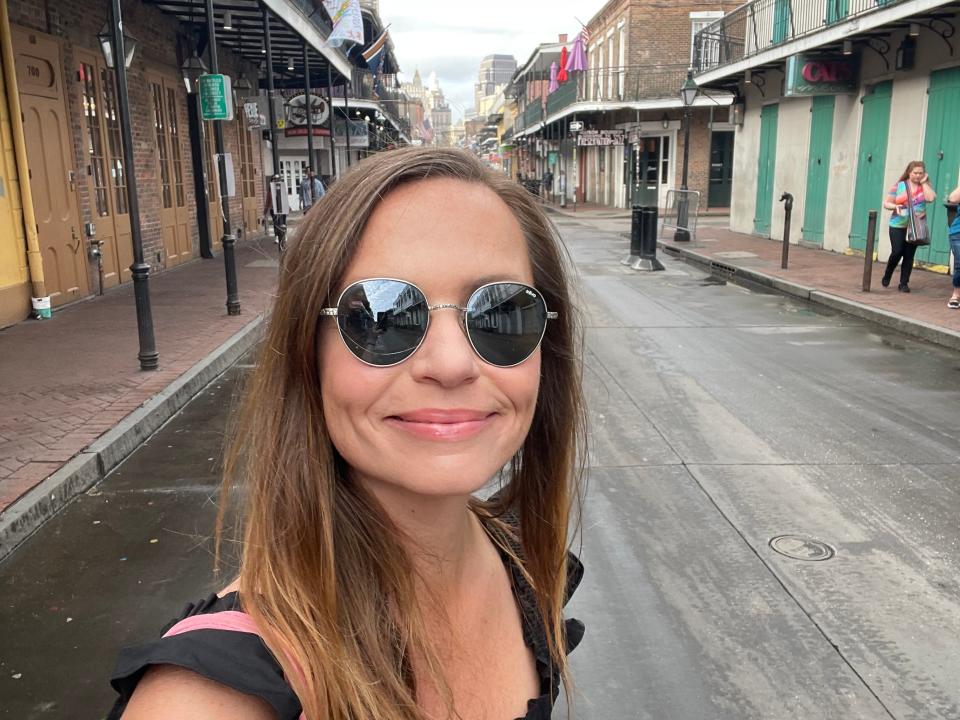 Emily taking a selfie on Bourbon Street in New Orleans.