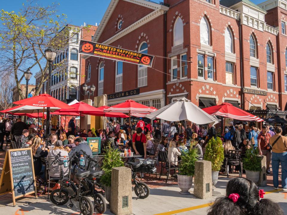 Crowds of people gathered at a Halloween marketplace in Salem, Massachusetts.