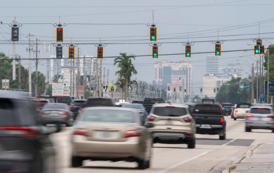 Traffic travels eastbound along Okeechobee Boulevard on August 9, 2024, in West Palm Beach, Florida.