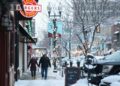 A couple walks on the snowy sidewalk on Wednesday, Jan. 10, 2024 on Phillips Avenue in Downtown Sioux Falls.