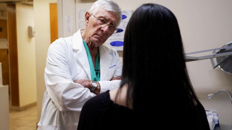 Dr. Warren Hern speaks with Willow in one of the procedure rooms at the Boulder Abortion Clinic.