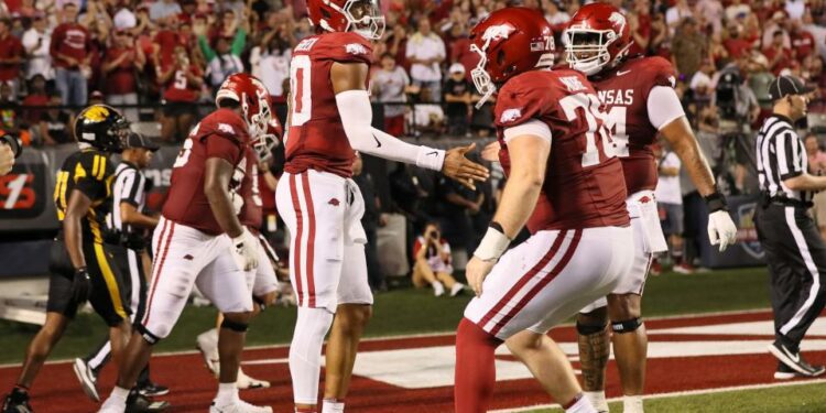 Aug 29, 2024; Little Rock, Arkansas, USA; Arkansas Razorbacks quarterback Taylen Green (10) celebrates after scoring a touchdown in the second quarter against the Pine Bluff Golden Lions at War Memorial Stadium.