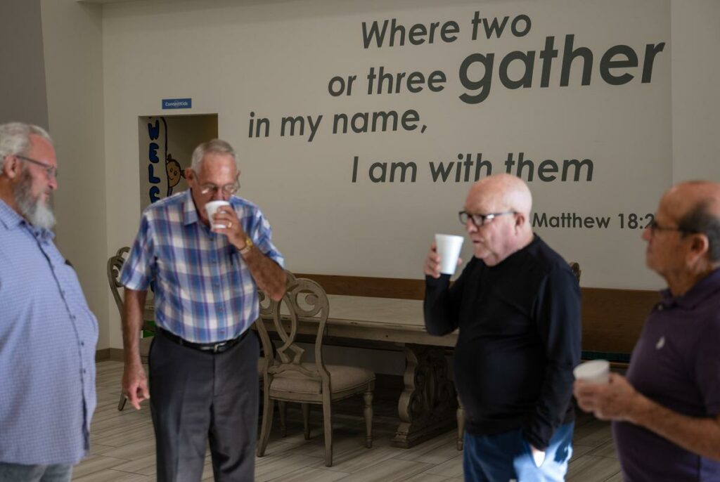 Congregation members of Connection Christian Church gather for a conversation before the start of the church’s Classic service Sunday, Aug. 11, 2024, in Odessa.