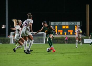 Junior forward Tyler Isgrig dribbles through defenders during Baylor soccer's 1-0 loss to Arizona Thursday night at Betty Lou Mays Field. Mary Thurmond | Photographer