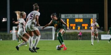 Junior forward Tyler Isgrig dribbles through defenders during Baylor soccer's 1-0 loss to Arizona Thursday night at Betty Lou Mays Field. Mary Thurmond | Photographer