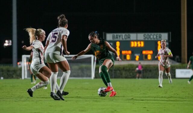 Junior forward Tyler Isgrig dribbles through defenders during Baylor soccer's 1-0 loss to Arizona Thursday night at Betty Lou Mays Field. Mary Thurmond | Photographer